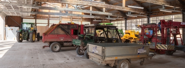 Wooden building for the Machinery Store housing various vehicles